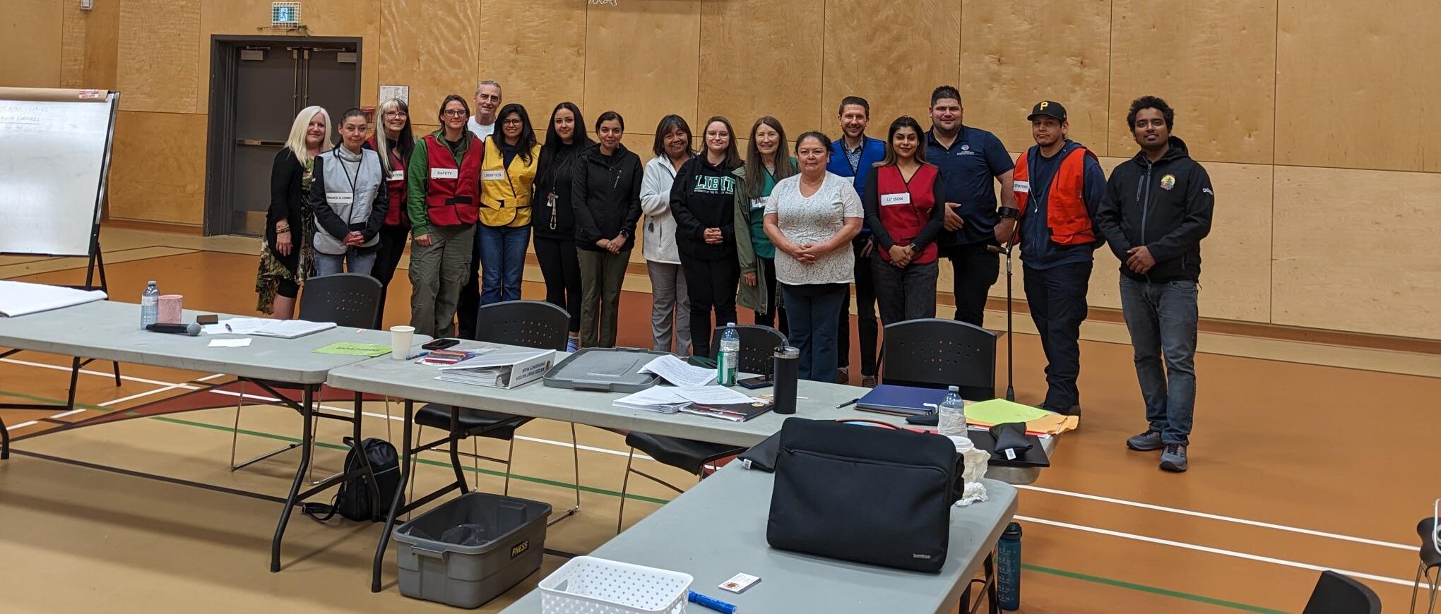 EOC Table Top Training 2 photo group photo in a school gym for emergency response training