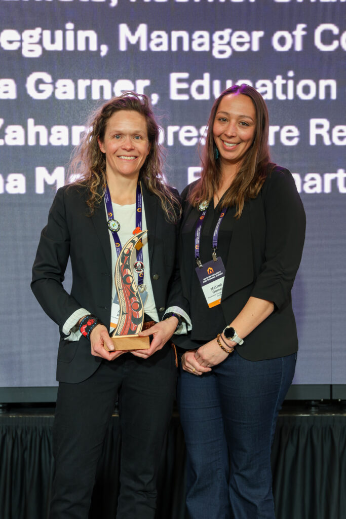 Amanda Reynolds and Malina Garner posing during the Lynn Orstad Award Ceremony at the 2025 Wildfire Resiliency and Training Summit