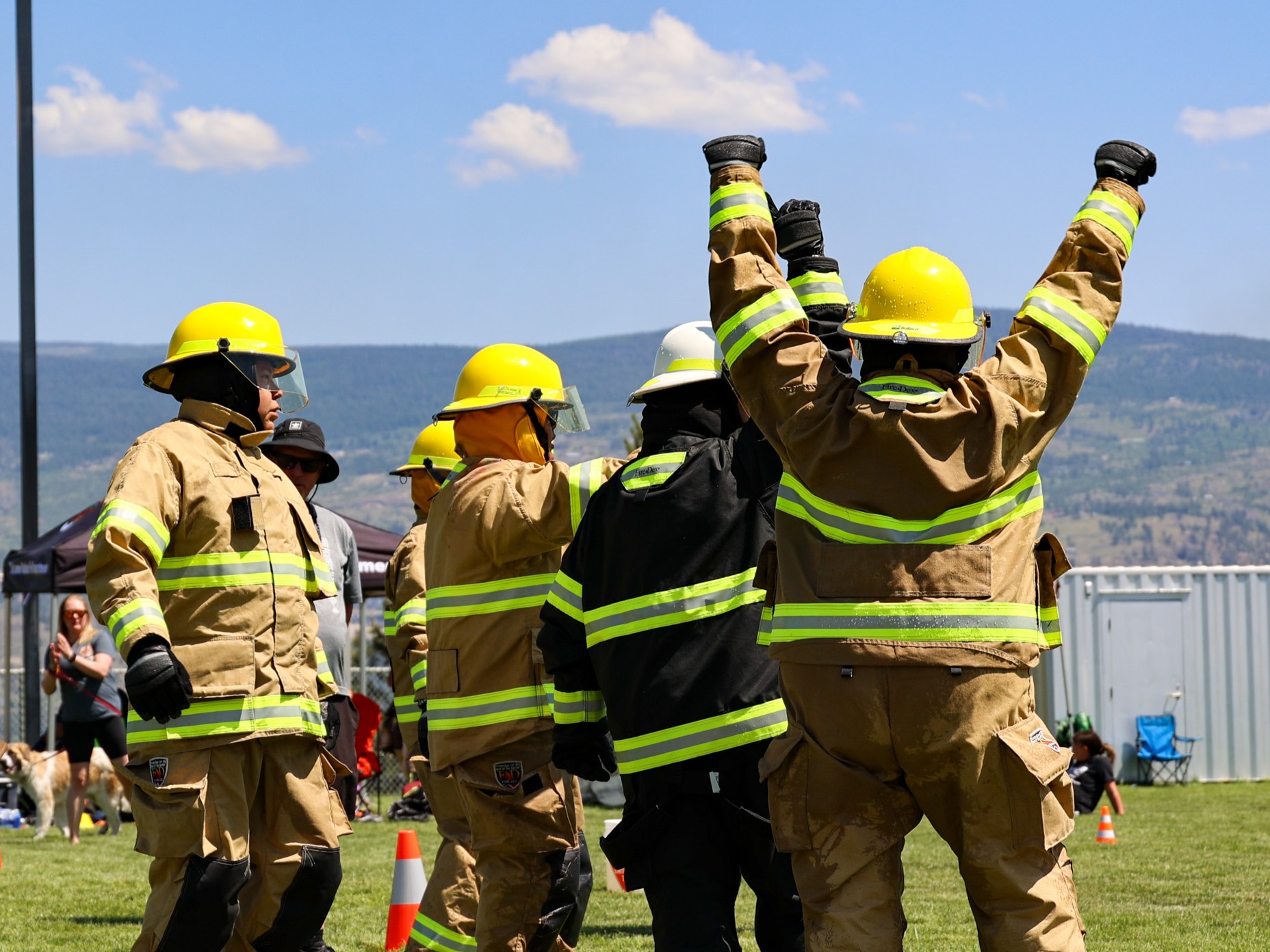 youth smiling holding fire house