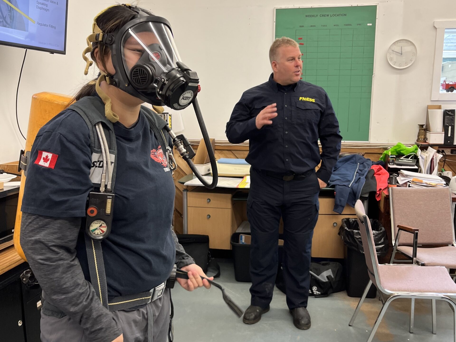 youth smiling holding fire house